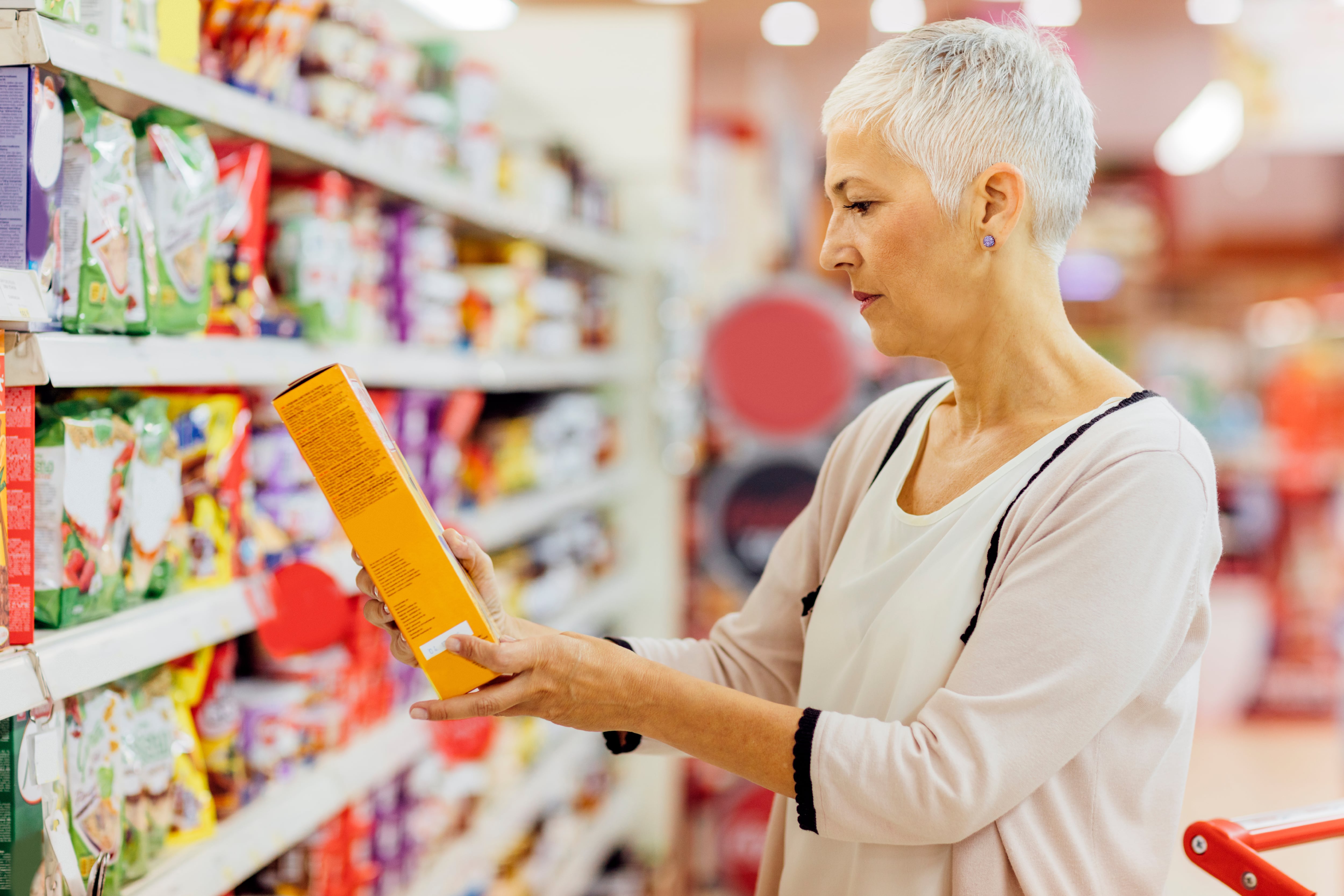 Woman looking at cereal box