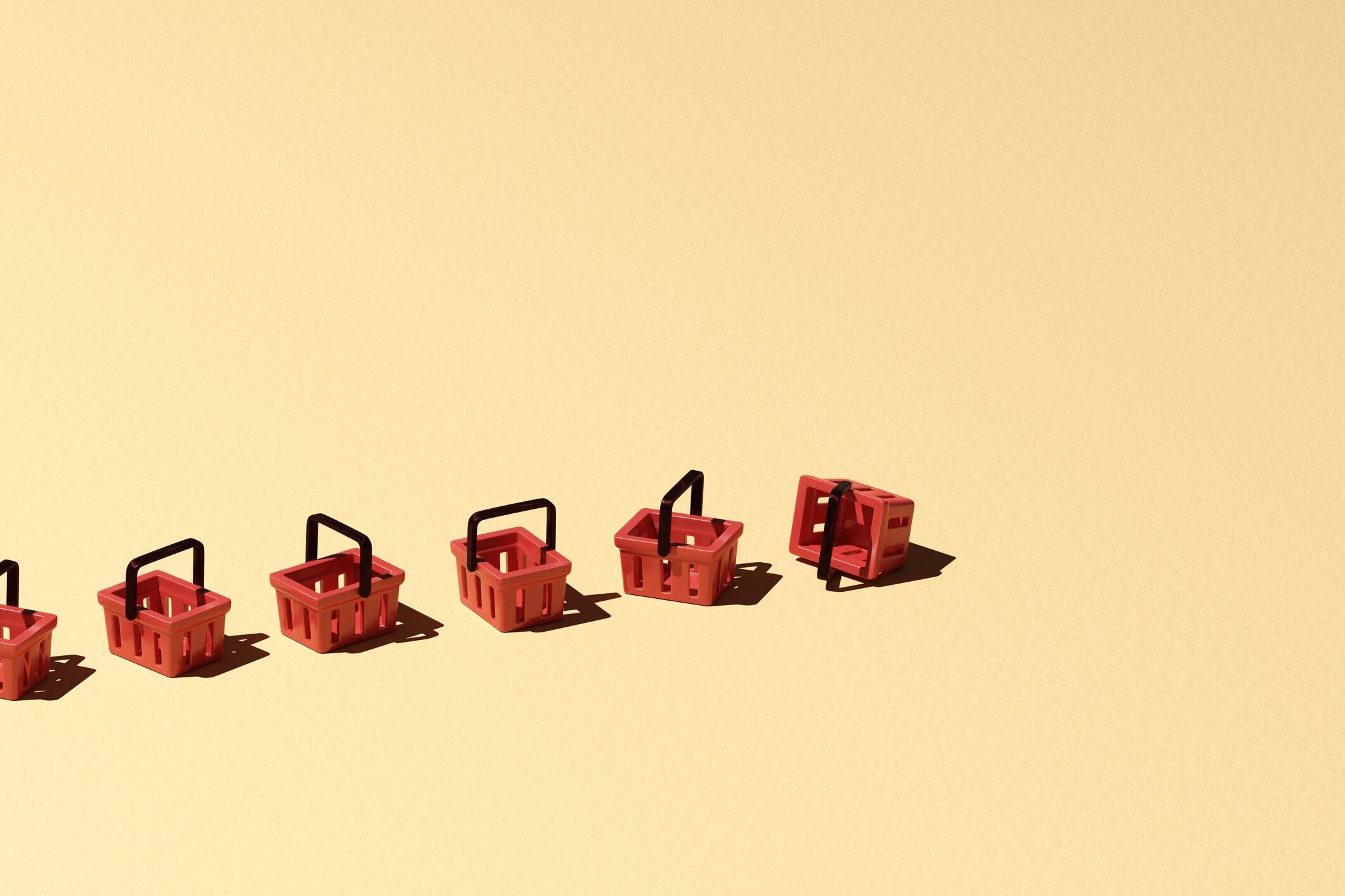 red shopping baskets are casually positioned in a row J Studios GettyImages