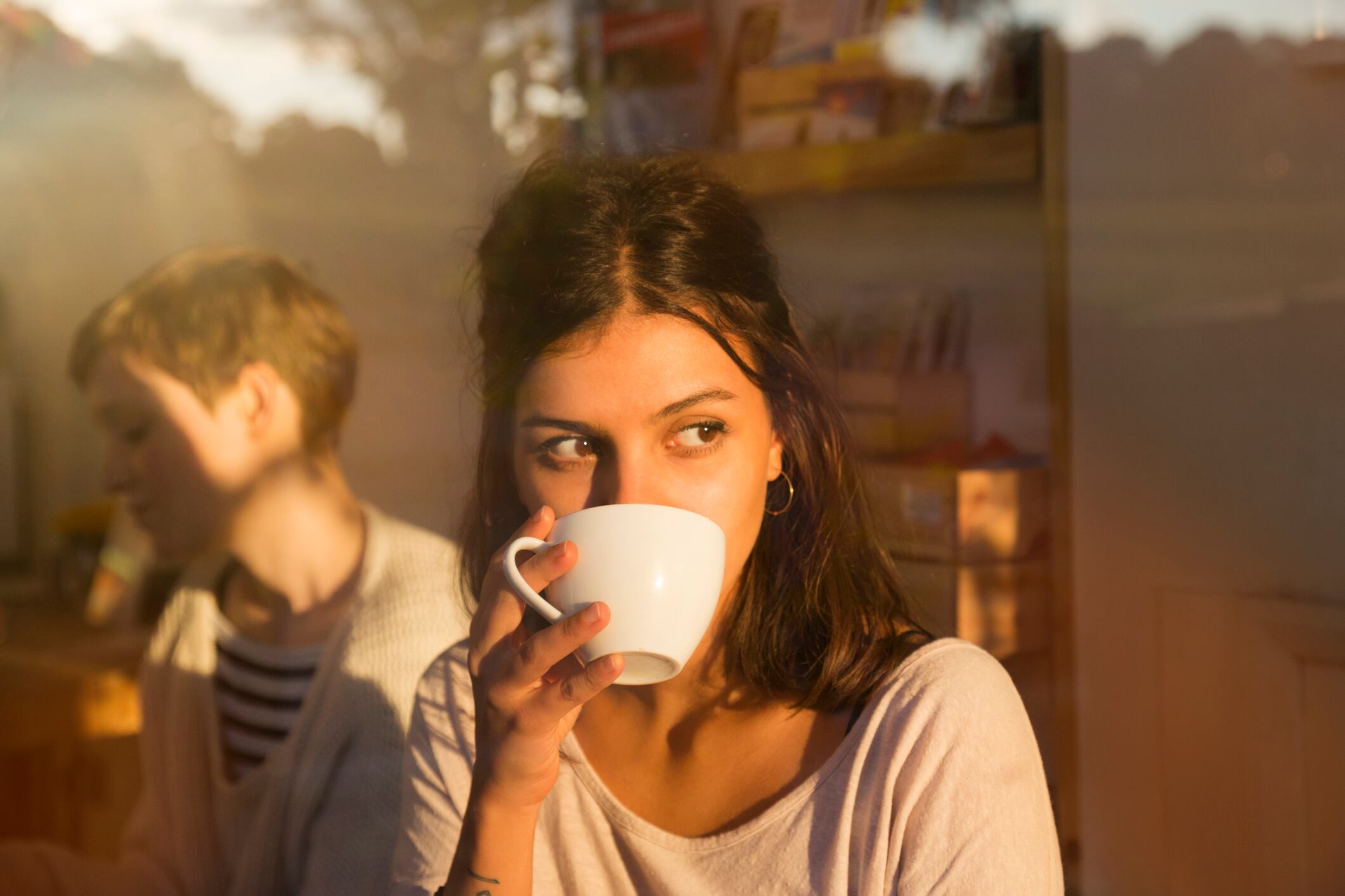 Woman in cafe drinking coffee