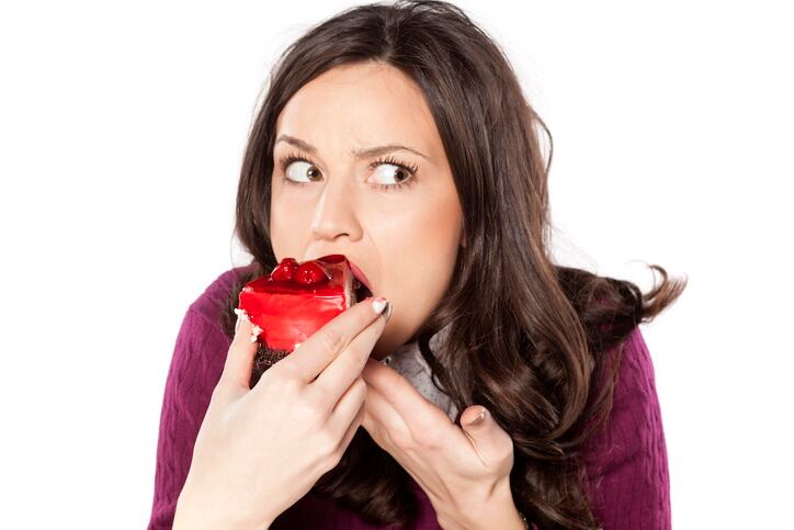 GettyImages-VladamirFLloyd-cake-eating-junk-food.jpg