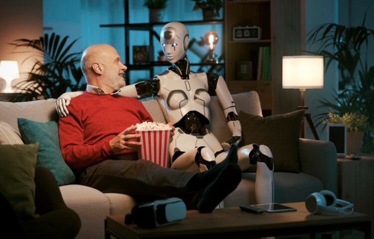 Senior man and caring robot sharing snacks