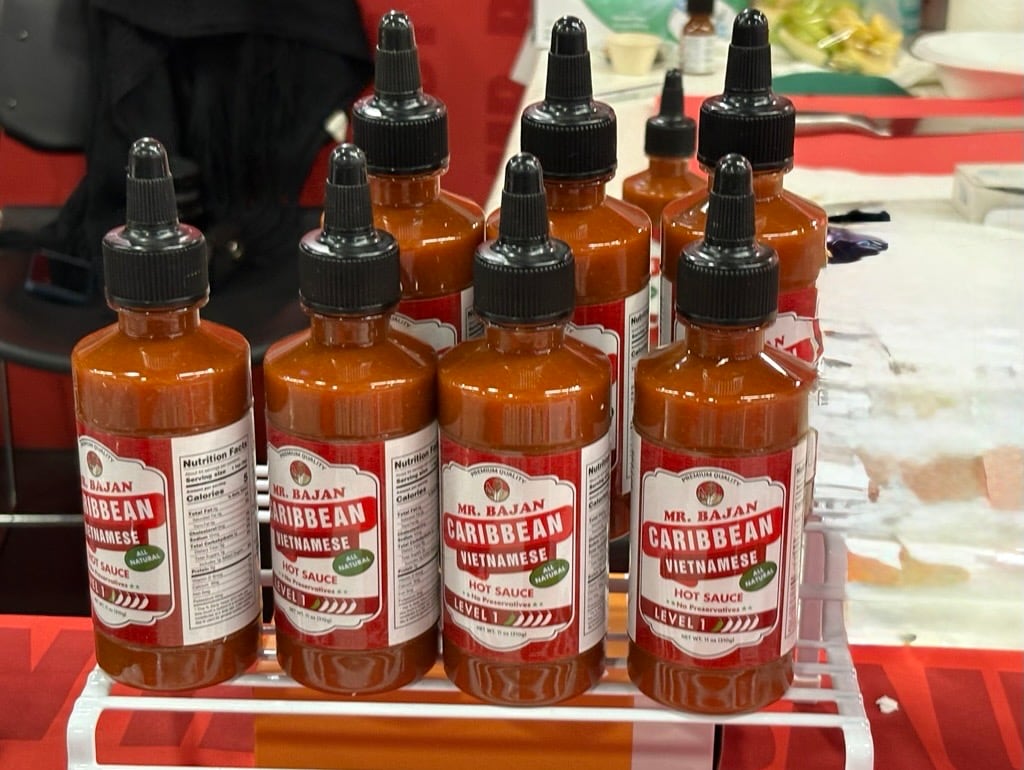 Lineup of Mr Bajan's hot sauces in Level 1 and Level 2 heat during Expo West