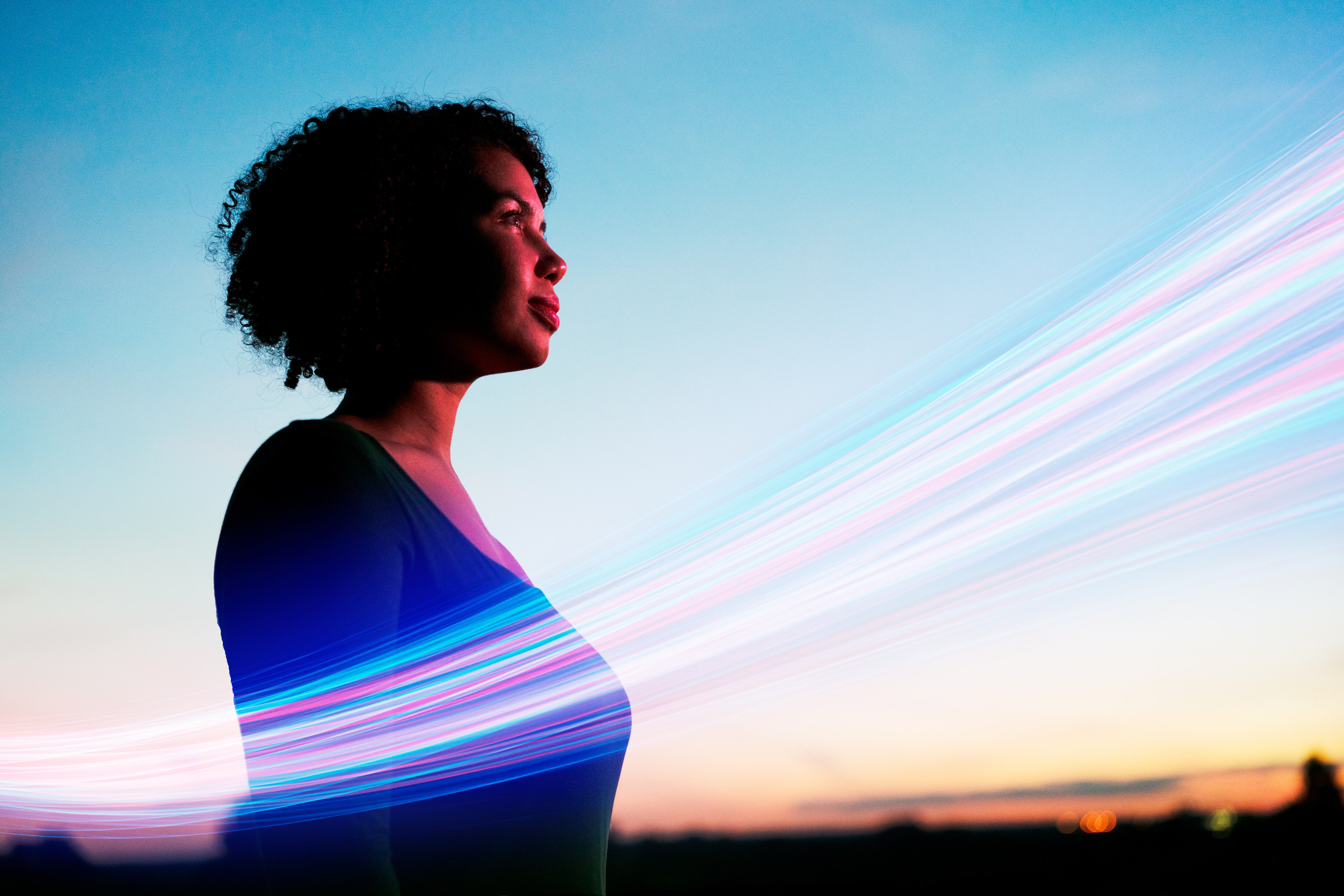 Woman looking ahead with light streak