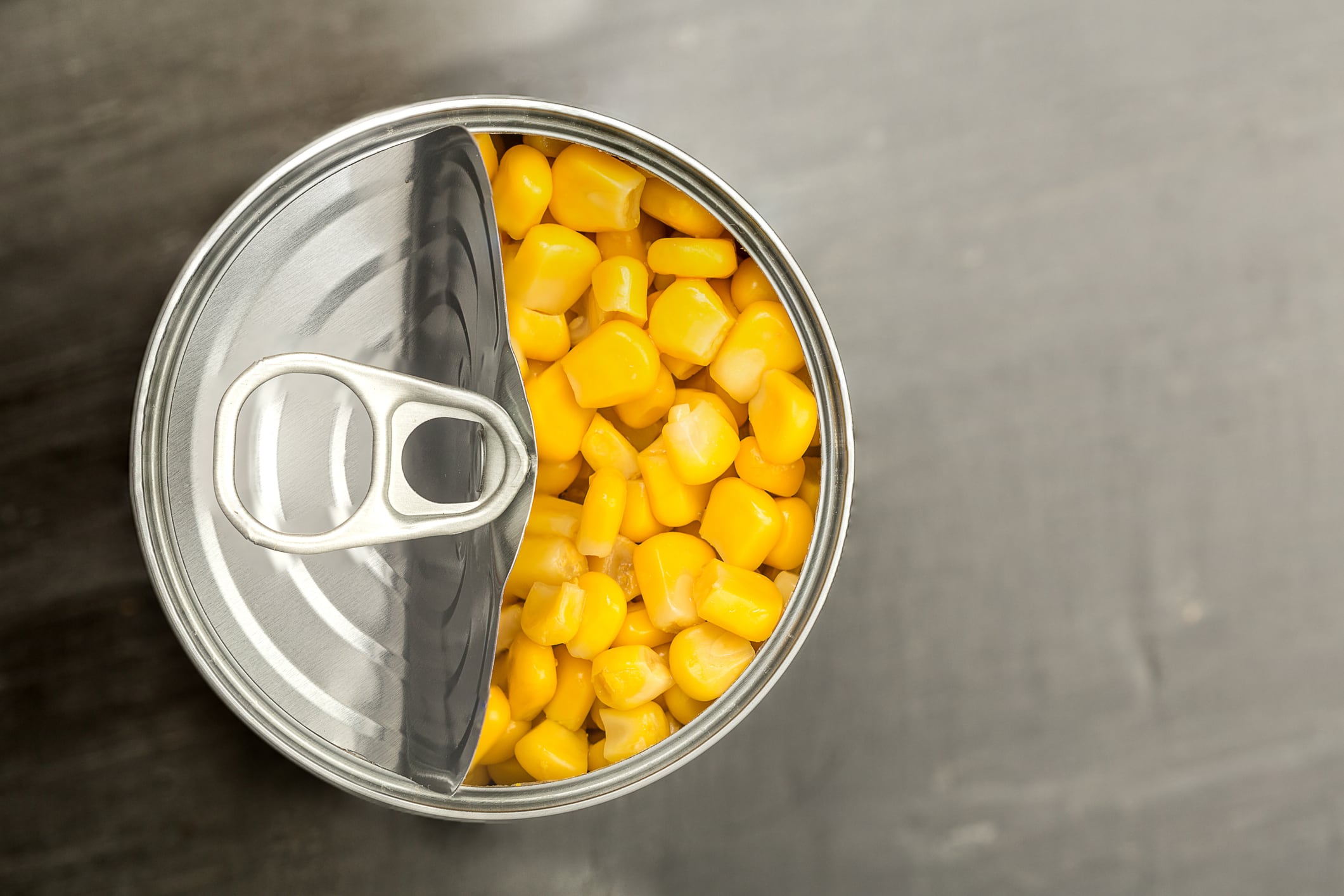 looking down on a tin can of sweet corn