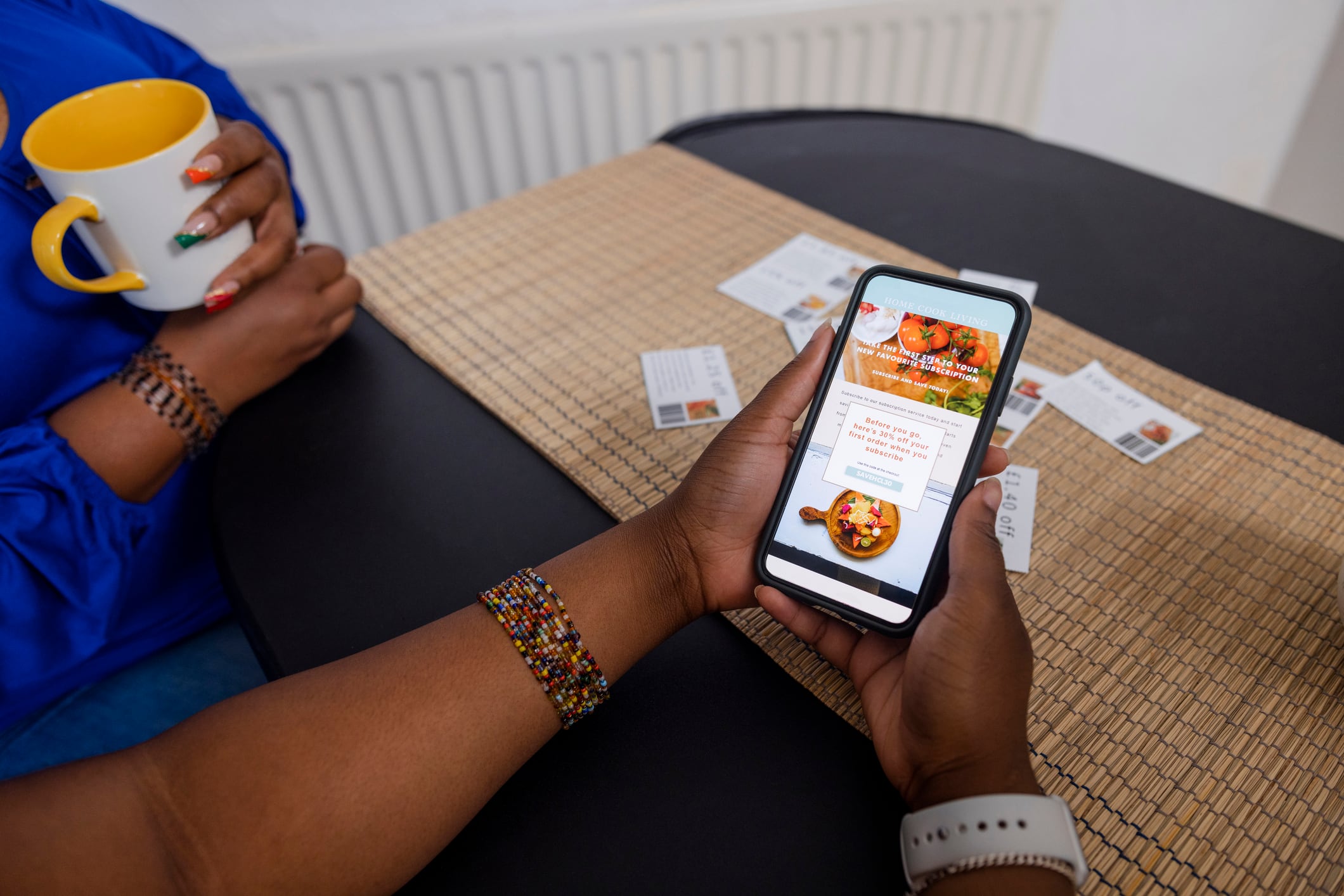 Consumer using digital coupons at point of purchase.