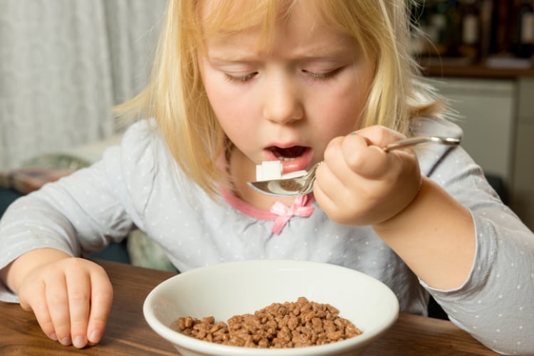 Child eating sugary cereal