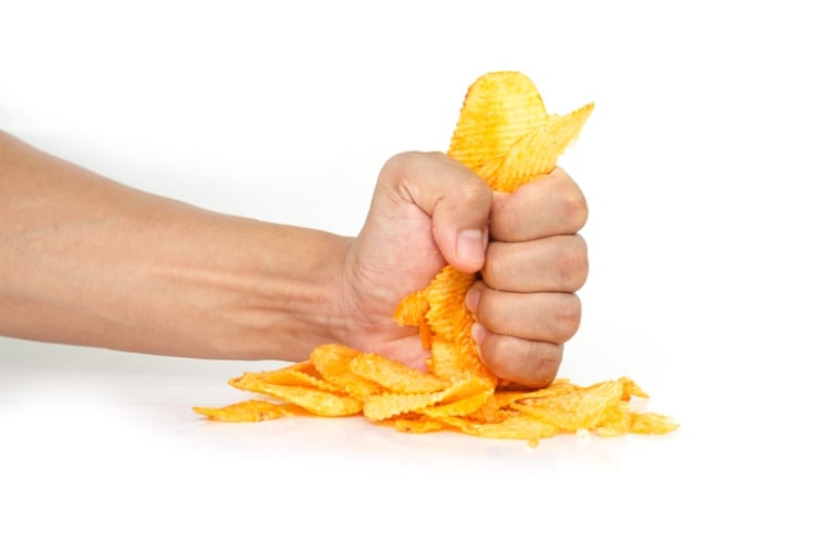 Fist bashing potato chips