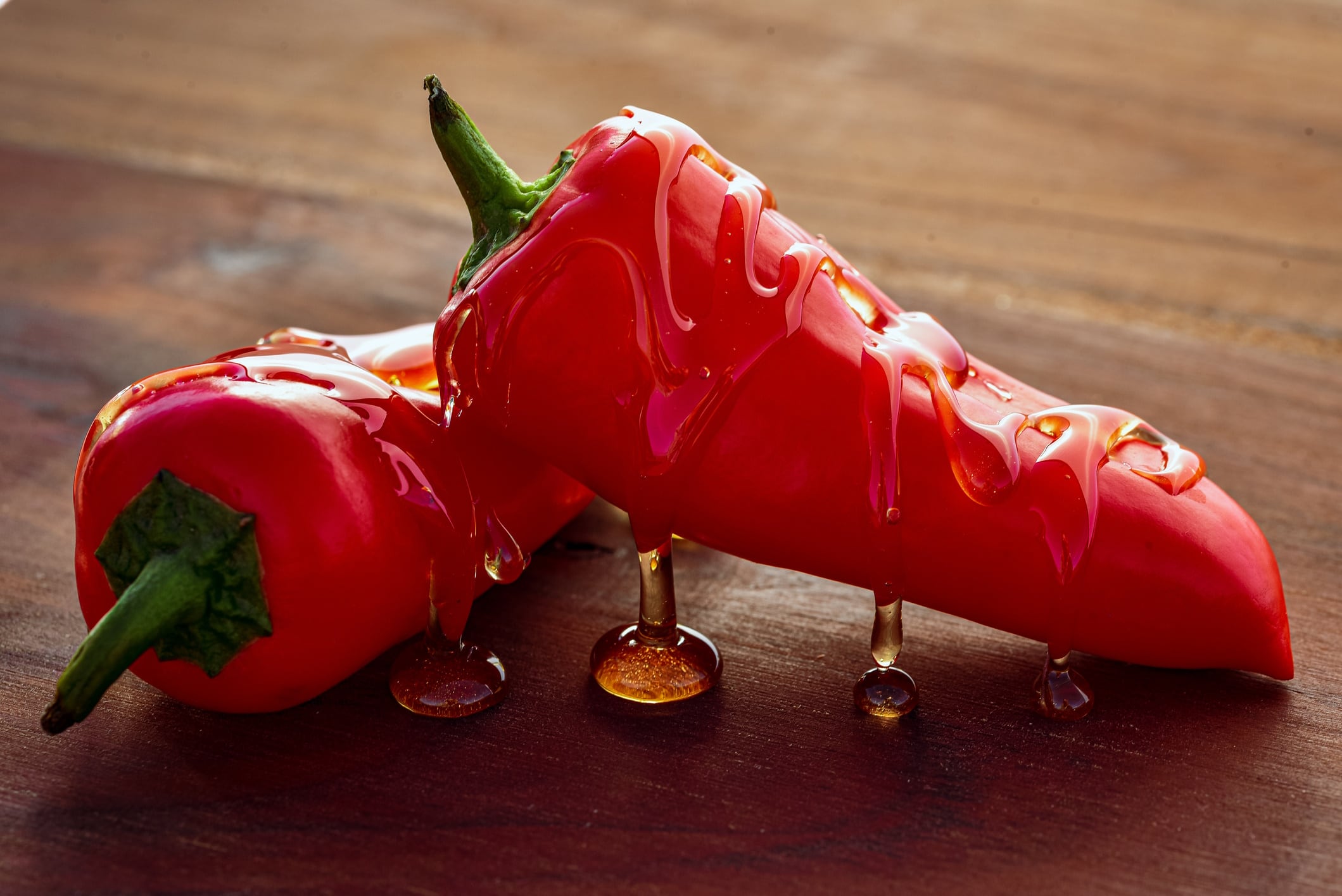 Honey drizzled whole red chili peppers