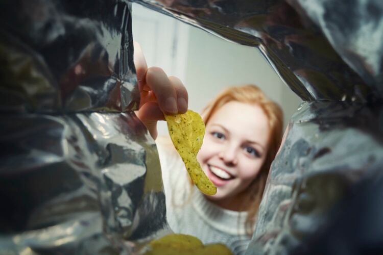 Girl eating potato chips