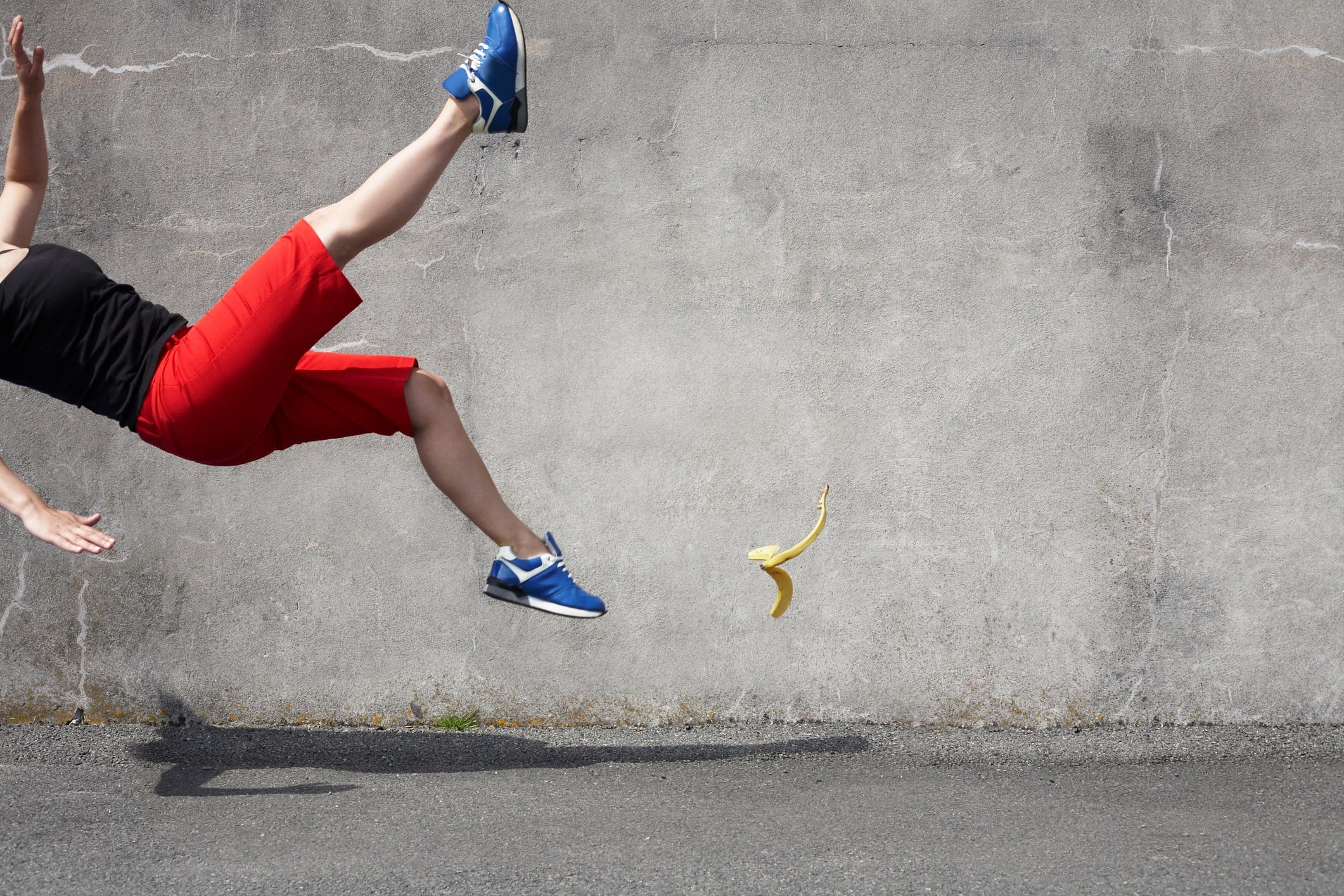 Woman falling on a banana skin.