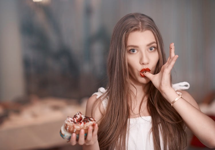 Woman eating a doughnut