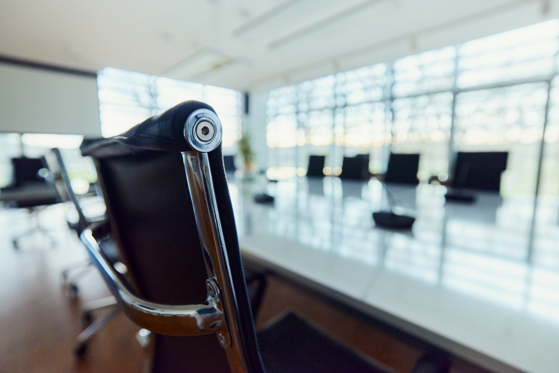 Close up of a chair in empty conference room