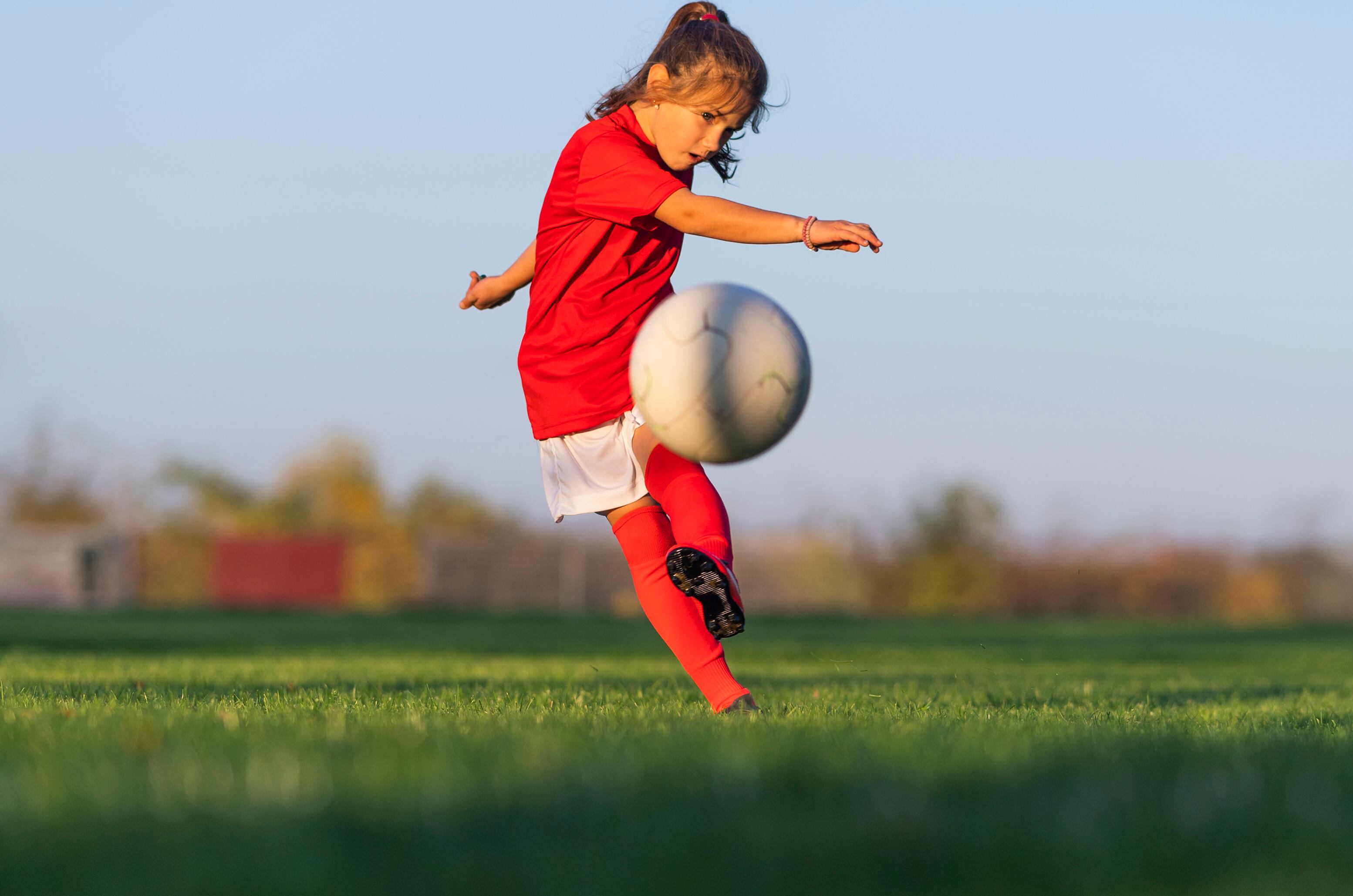 Young girl playing soccer