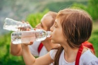 bottled water hydration beverage drink children kids iStock Kerkez