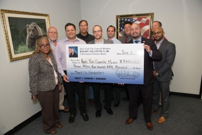 Rafael Salamanca Jr (front,right) presented the oversized multi-million dollar cheque to the Co-Op