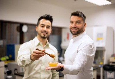 MeliBio co-founders Aaron Schaller, PhD (left) and Darko Mandich (right) holding prototypes of MeliBio honey made without bees (picture credit: MeliBio)