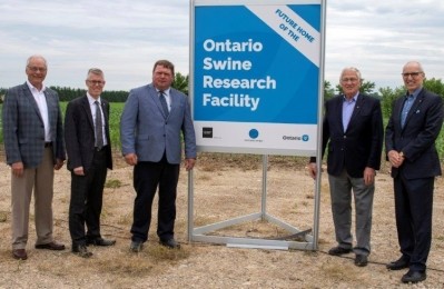 Randy Pettapiece, Malcolm Campbell, John de Bruyn, Minister Hardeman and Dr. Franco Vaccarino at the site of the new swine research facility