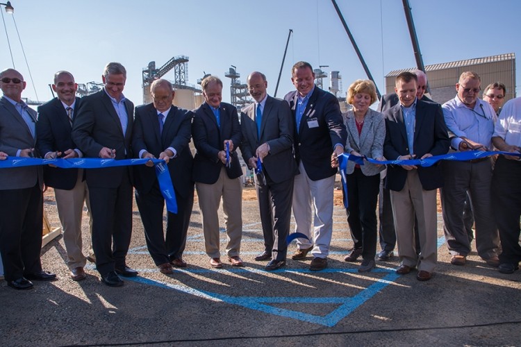 State officials helped Perdue cut the ribbon to open the new soybean plant