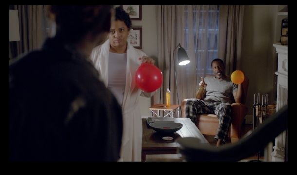 In a still from the new Sparkling ICE ad campaign, a teenage boy creeps into the house after a late night, and is challenged by his parents - and the family dog, who have been inhaling helium from balloons...