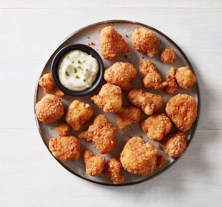 The Buffalo wing-style sharing platter is made with whole cauliflower florets. © Wholly Veggie