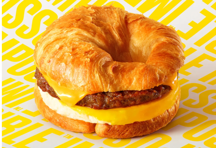 Burger King's Impossible Croissan’wich includes a seasoned plant-based sausage patty, chicken eggs and melted dairy cheese on a non-vegan croissant. (Picture: Impossible Foods)
