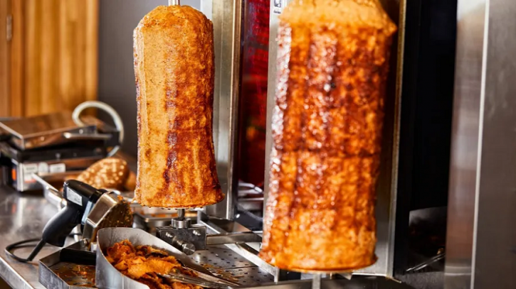 The well-loved döner kebab is made from meat stacked on a vertical skewer, which turns slowly on a rotisserie, before being sliced and served with accompaniments. Image source: Unilever