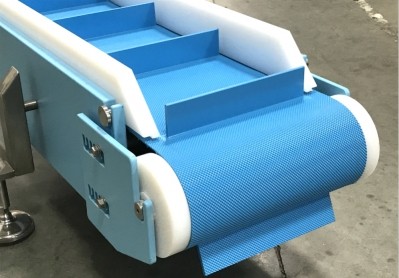 Dynamic Conveyor Corporation: Belt topper offers new option for conveying sticky foods
