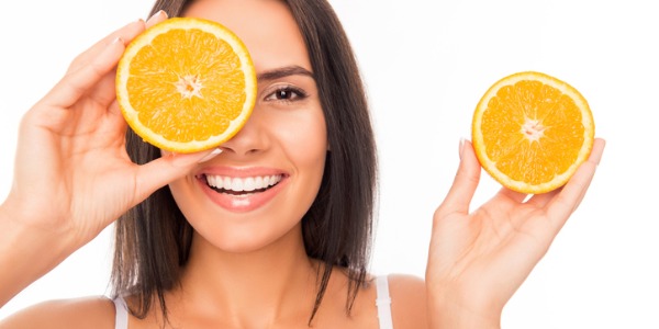 600_300_portrait-of-comic-happy-girl-holding-halves-of-orange-near-face-picture-id1137940974 (4)